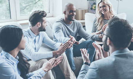A group of people in a circle talking