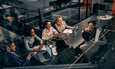group of people talking during a meeting 